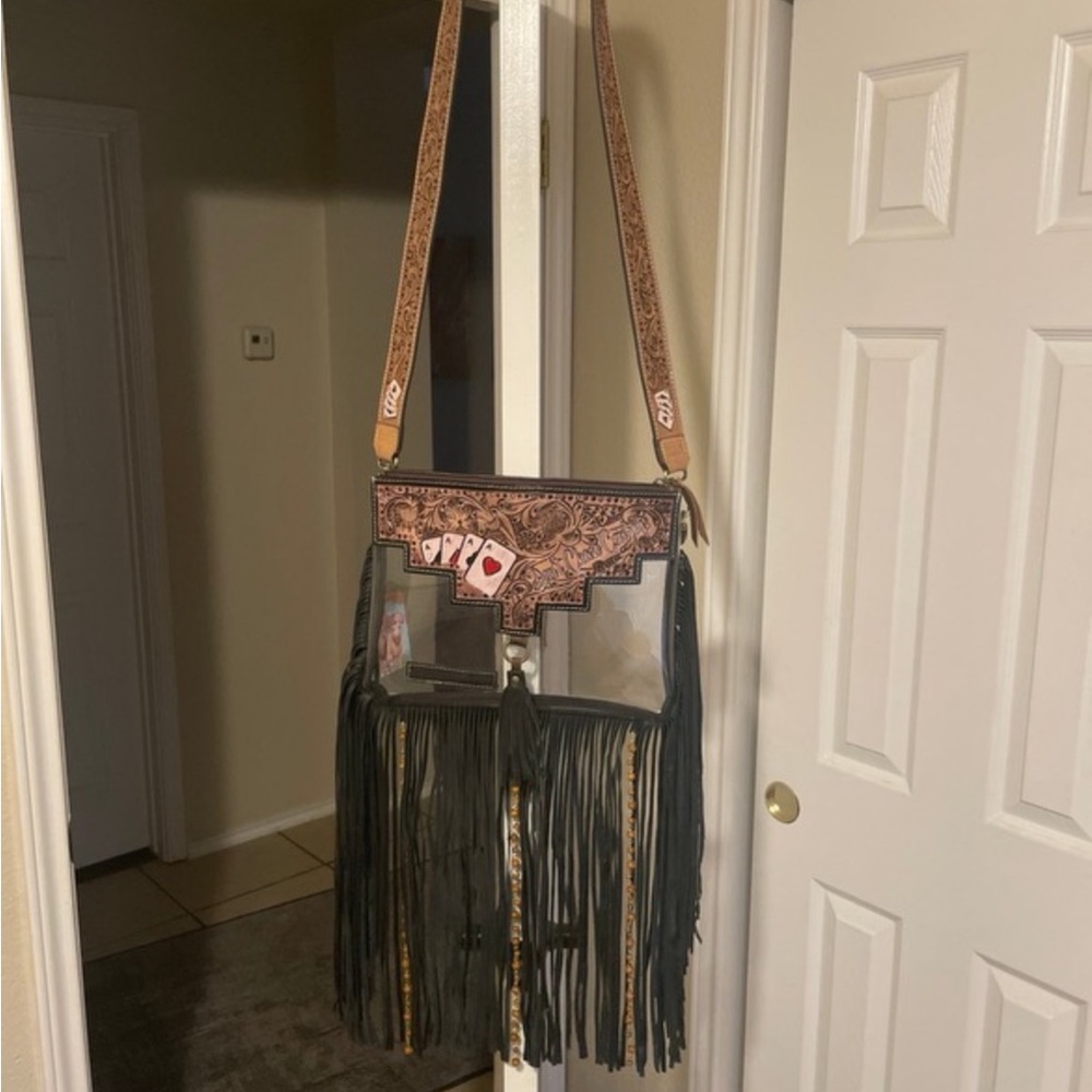 New w/ tags custom leather crossbody.  Hard carved and painted.